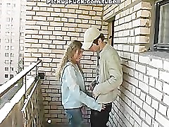 young blonde sucking on the veranda