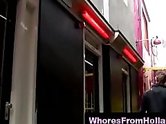 Red light hooker in pvc dress sucks client