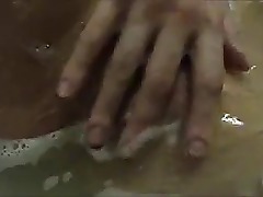 Russian whore masturbates in bathroom.