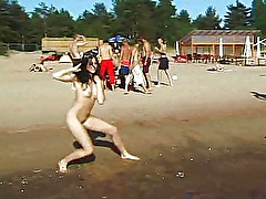 Slim teen with perky boobs naked at a nudist