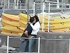 Guy play with his girl in the harbor, hidden cam.