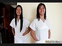 Two Filipina nurses take special care of patient