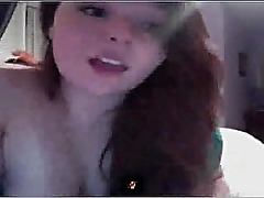 Cute redhead shows her huge tits on skype