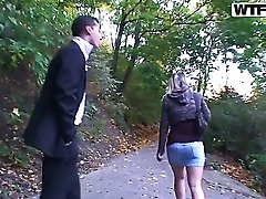 Amateur brunette Janet with juicy ass in denim skirt gets on knees and takes on two meaty peckers at once in the woods while dirty dues film her in pow.