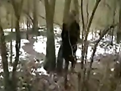 Amateur whore sucks two dick in the wood