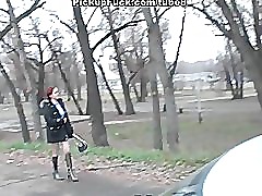 Redhead student sucks on the banks of the river for all to see