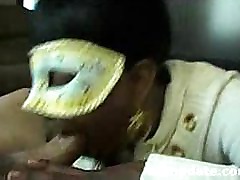 Black babe with mask sucks cock and swallows
